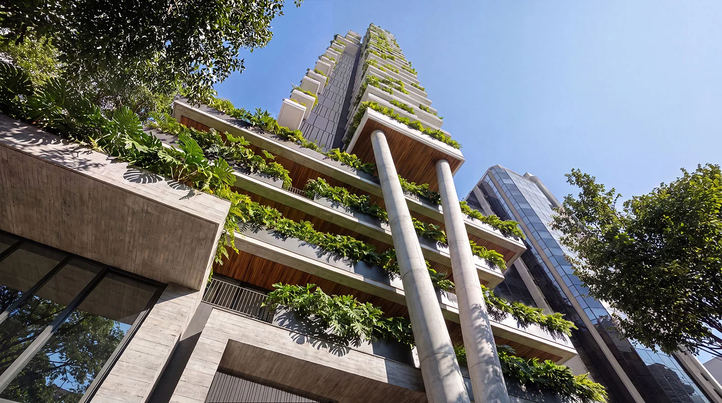 JOAH 233, vista inferior da torre com pilares e varandas ajardinadas, curadoria iApartamentos, Itaim Bibi